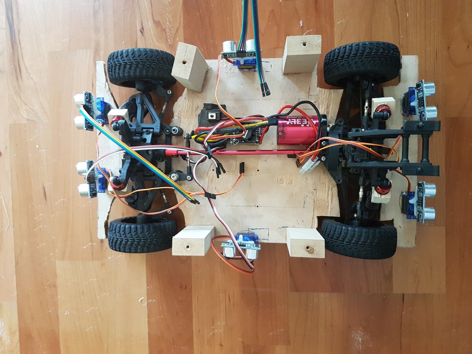 Autonomous car from above — servos, wiring, ultrasonic sensors