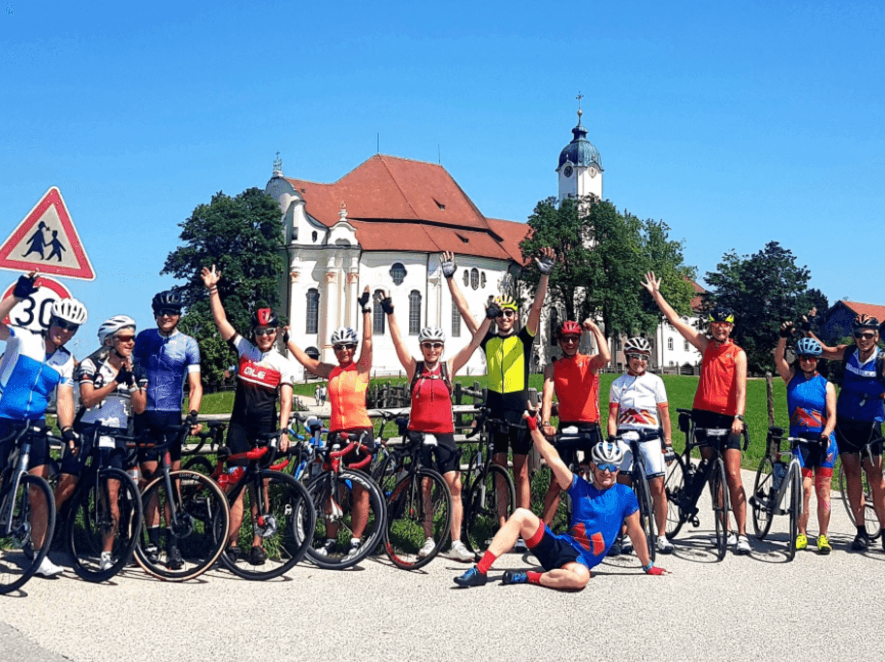 Group photo of cyclists at Wieskirche
