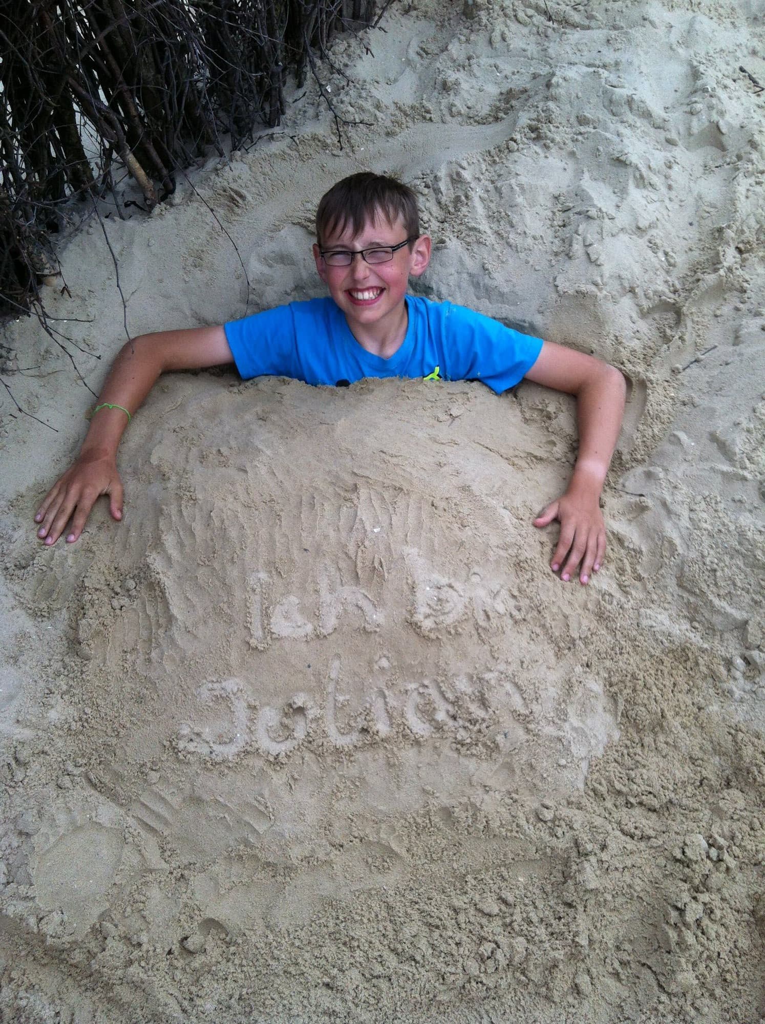 Buried in sand at the beach in Cuxhaven