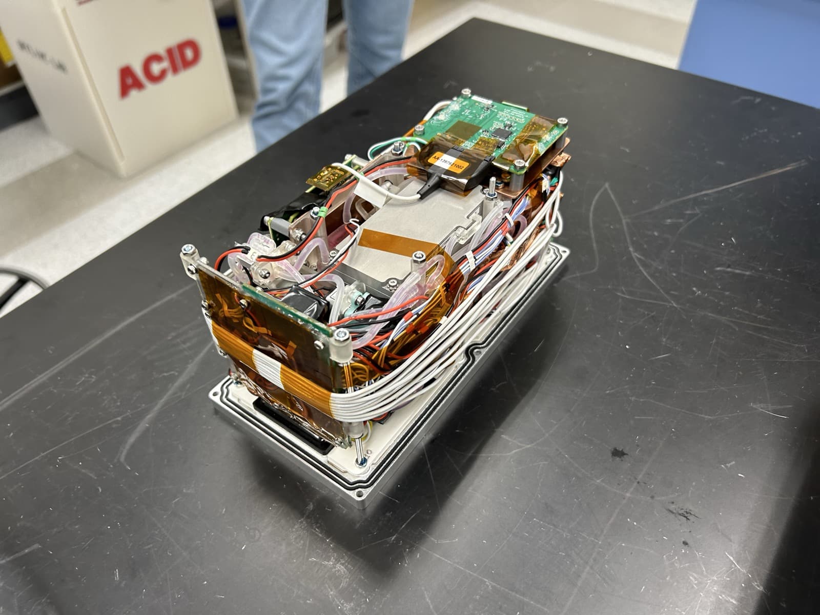 ADDONISS experiment cube internals with circuit boards, Raspberry Pi, and wiring