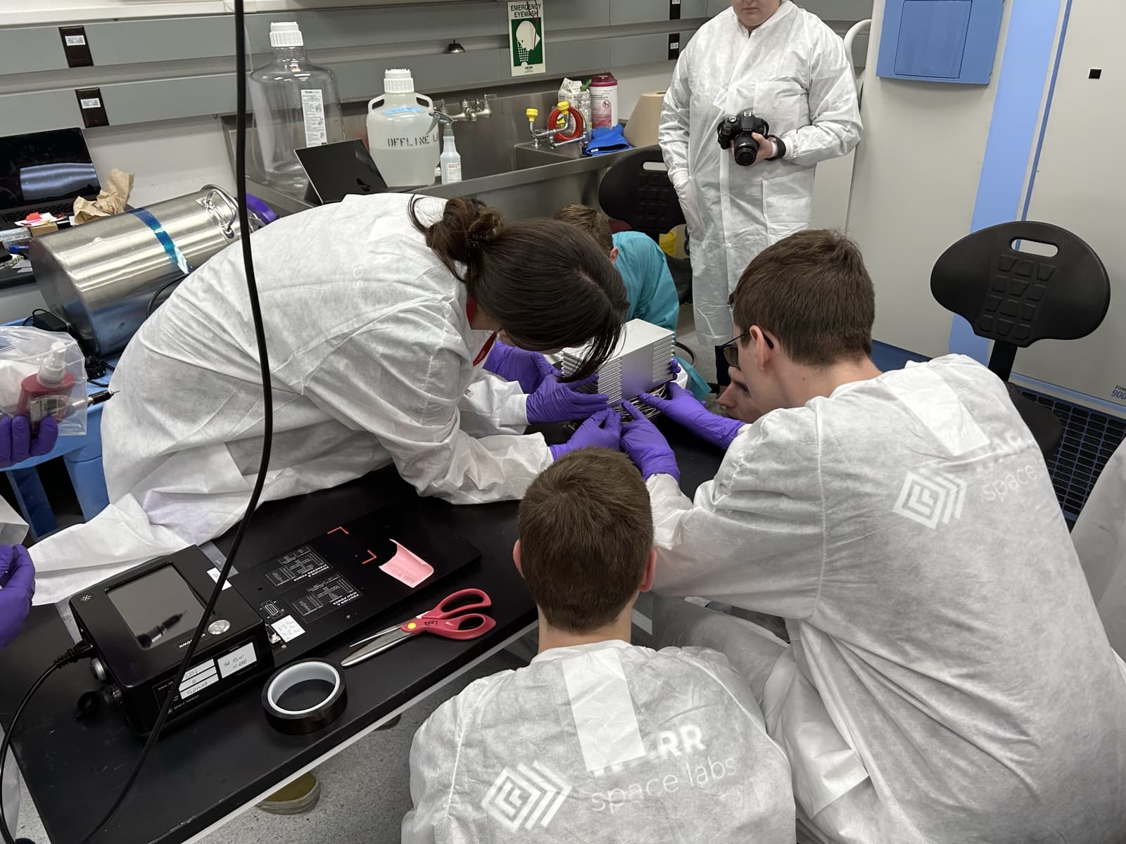 Team in Space Tango cleanroom integrating the ADDONISS experiment